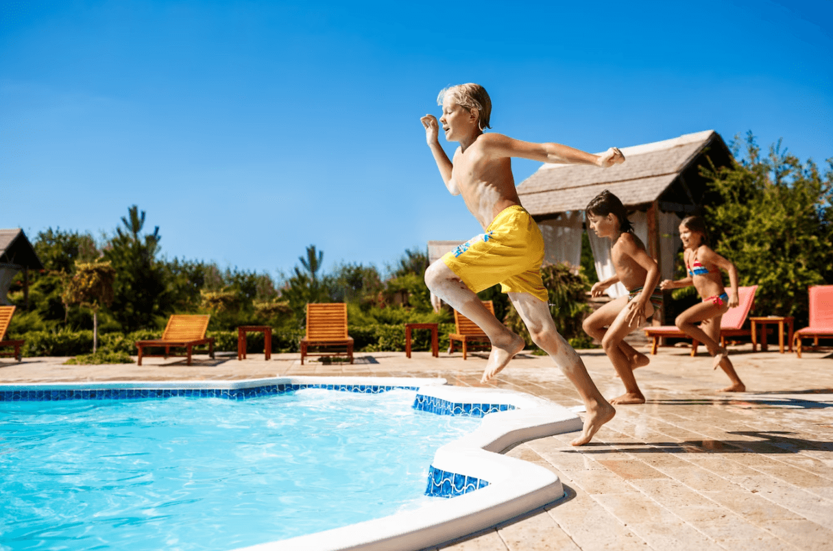 kids swim in pool