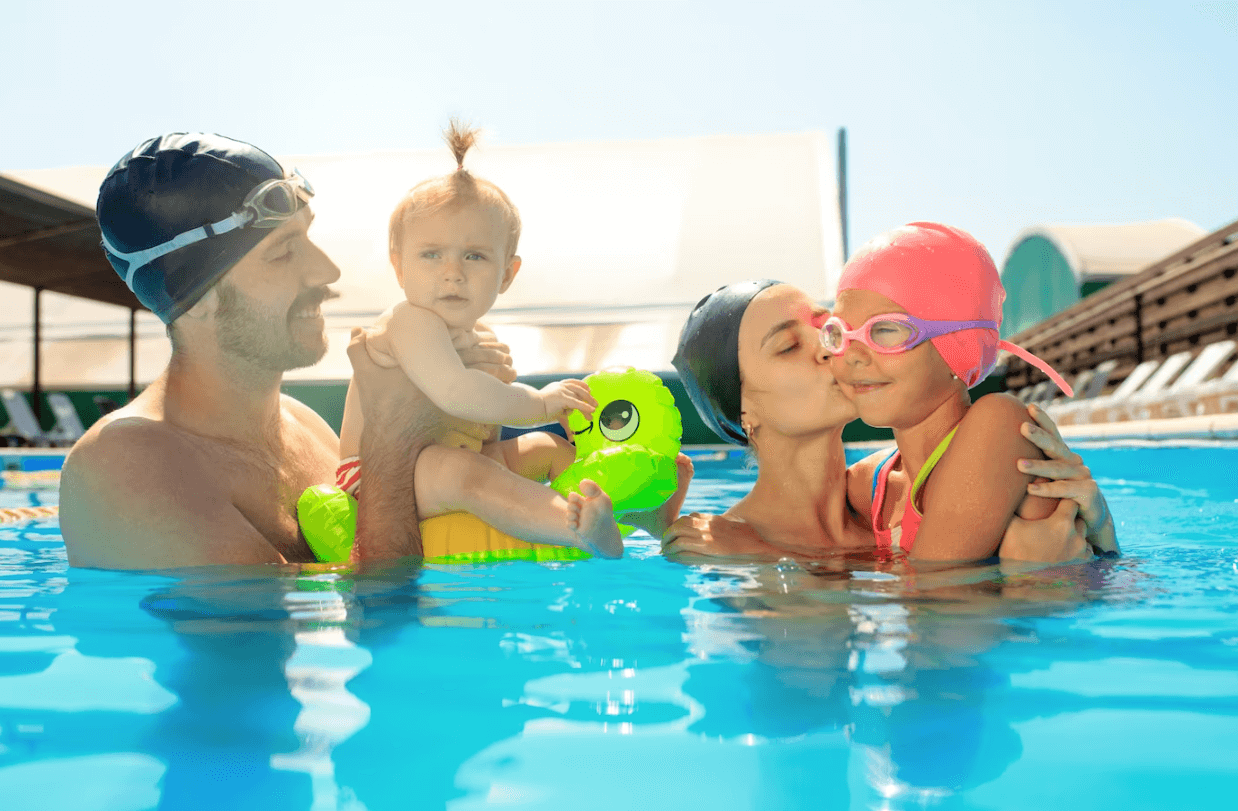 family swim in swimming pool & enjoy